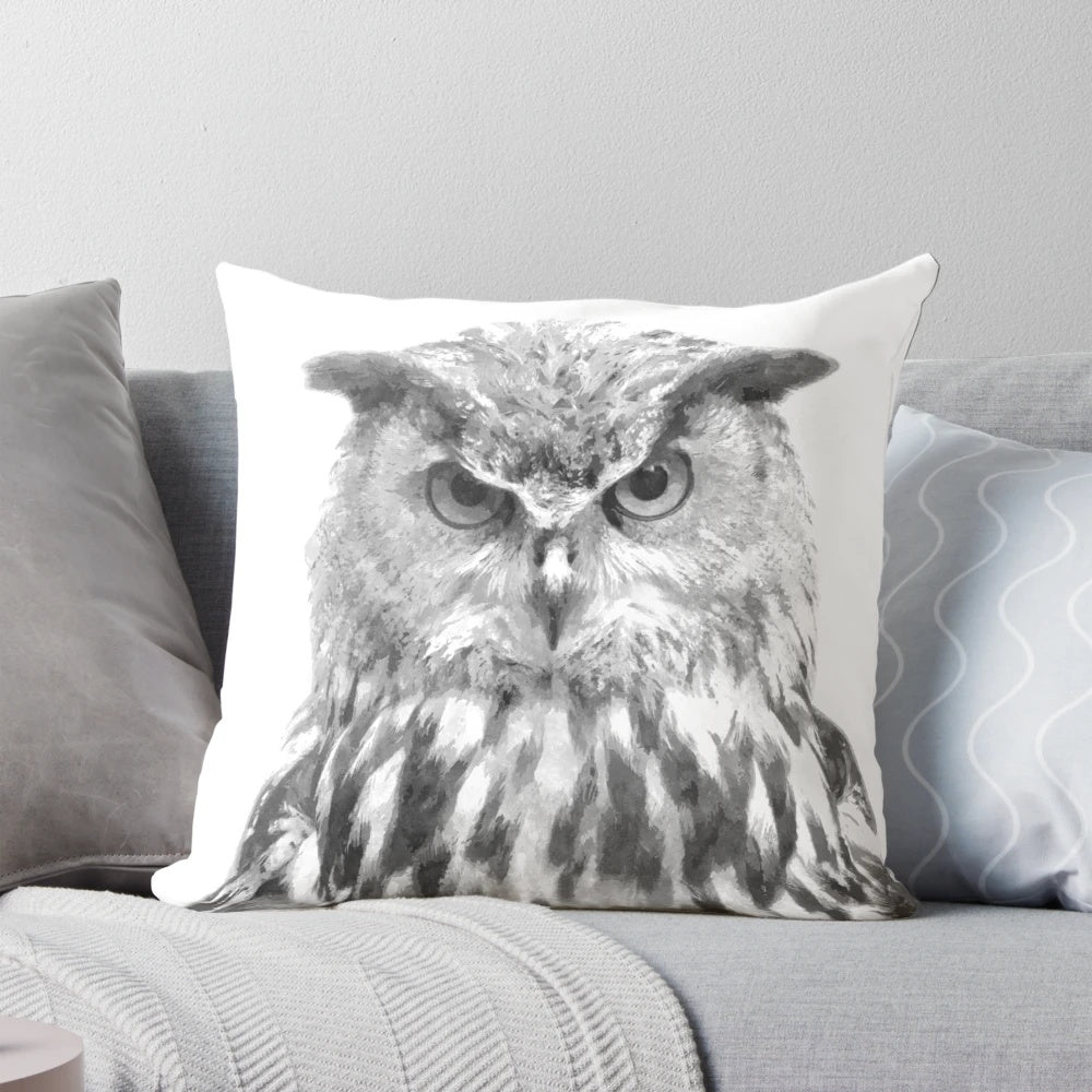 Beautifully rendered black and white owl portrait on a plush decorative pillow