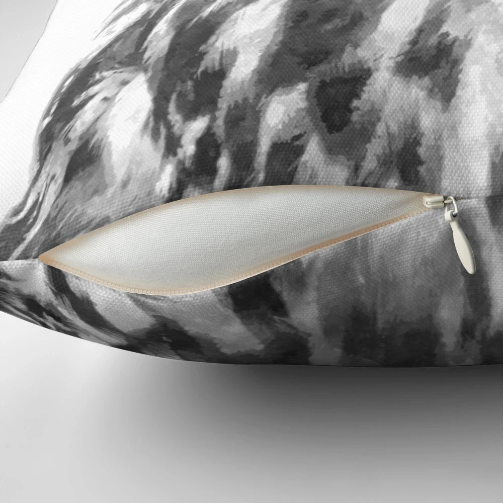 Beautifully rendered black and white owl portrait on a plush decorative pillow