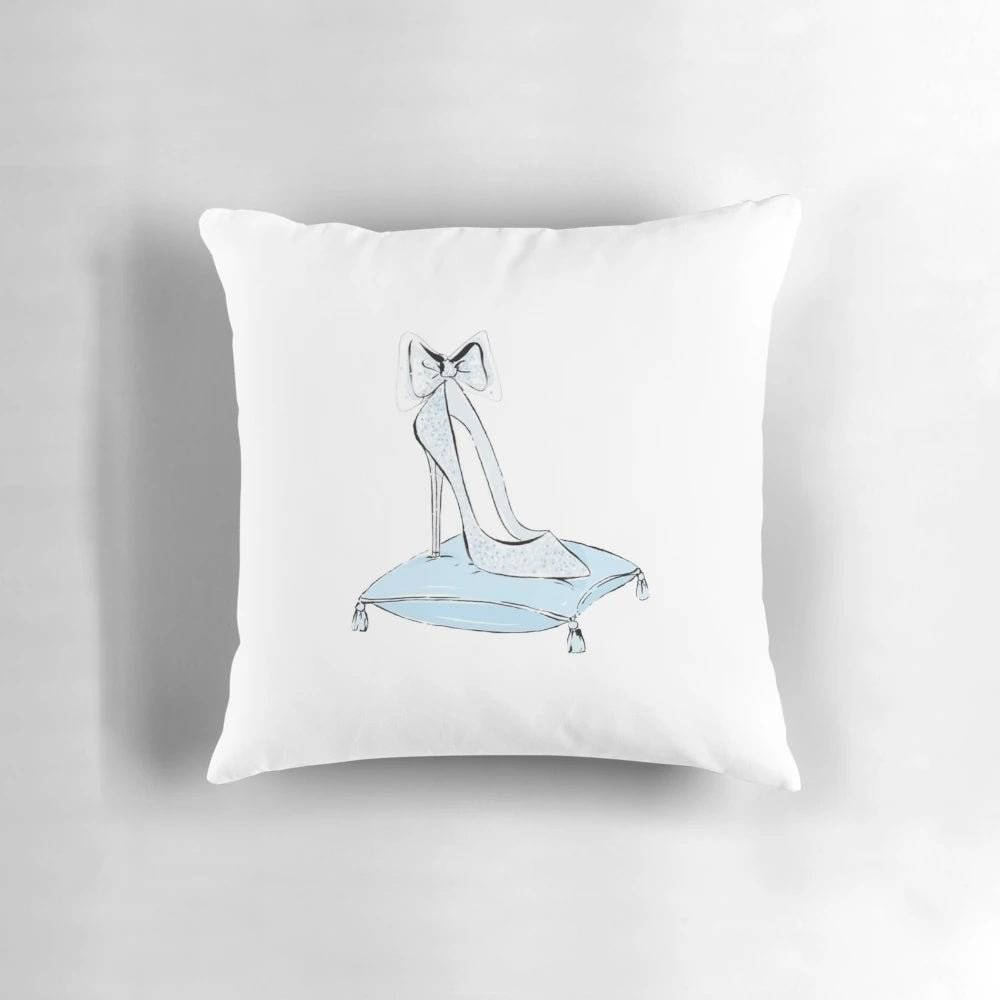 A blue princess-themed pillow featuring a glass slipper design and sparkling details.