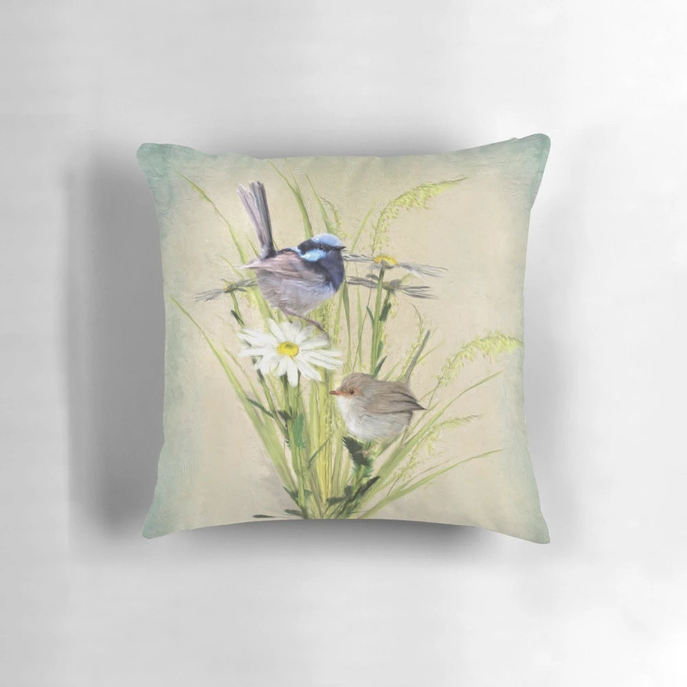 A soft, plush pillow featuring the vibrant blue and gray plumage of a fairy wren, a beloved Australian garden bird.
