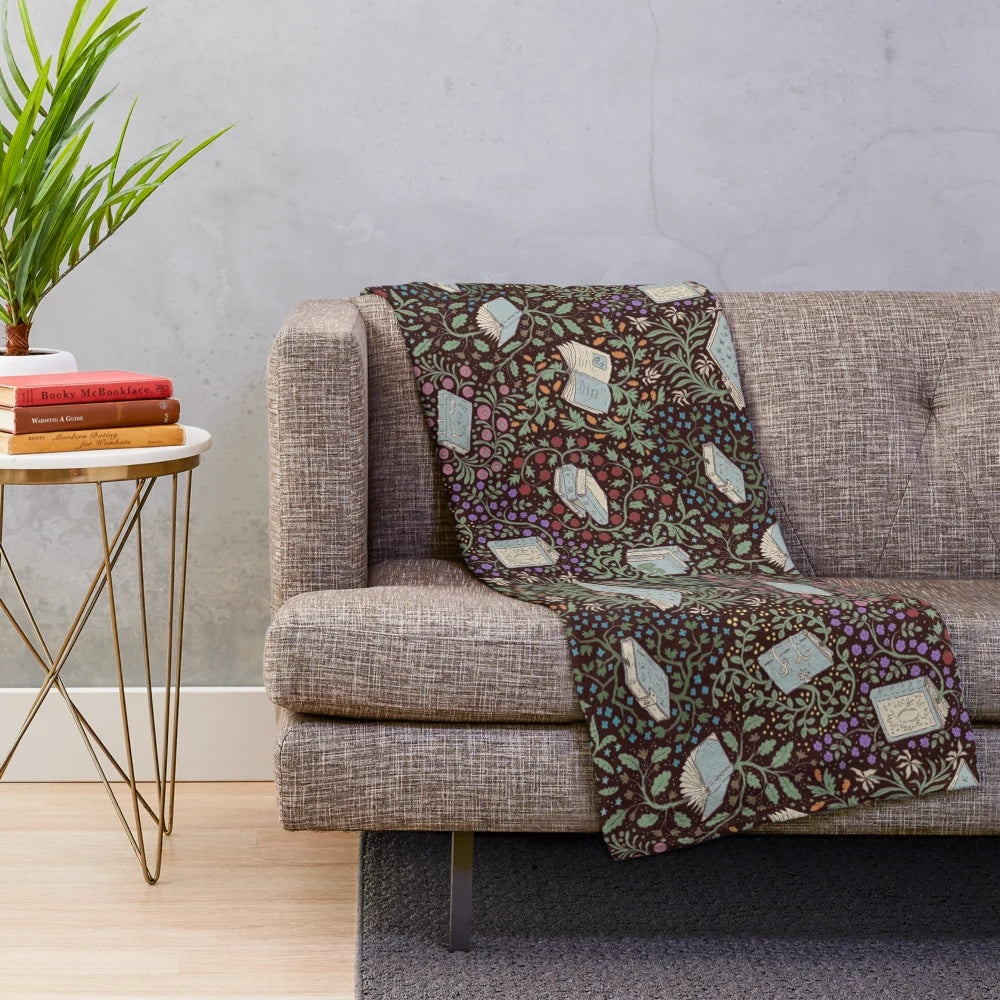 Soft and cozy plush blanket featuring a whimsical design of books and flowers in a fantasy woodland setting