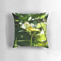 A beautifully detailed pillow featuring a butterfly resting on a dandelion, showcasing the intricate beauty of nature.