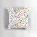 A soft, pastel-colored pillow featuring a whimsical butterfly garden design, perfect for adding a touch of nature to any room.