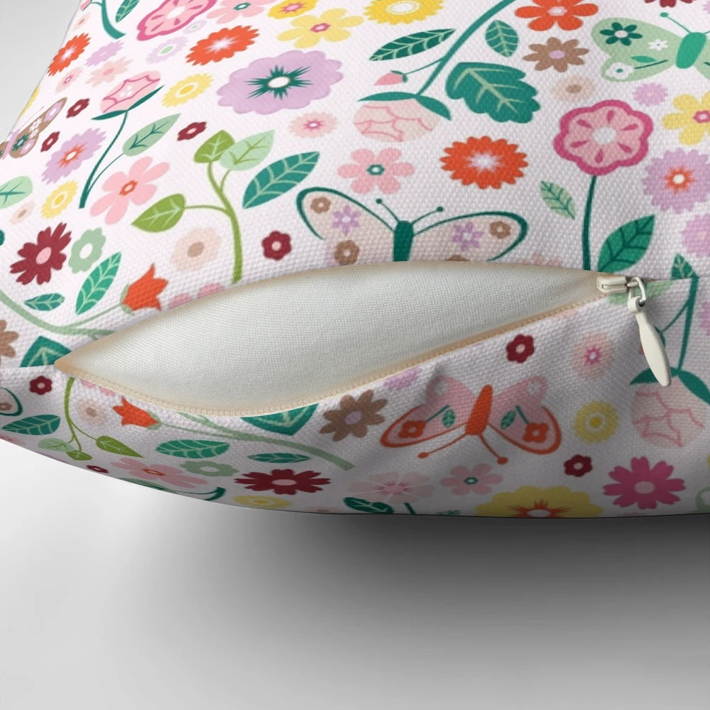 A soft, pastel-colored pillow featuring a whimsical butterfly garden design, perfect for adding a touch of nature to any room.