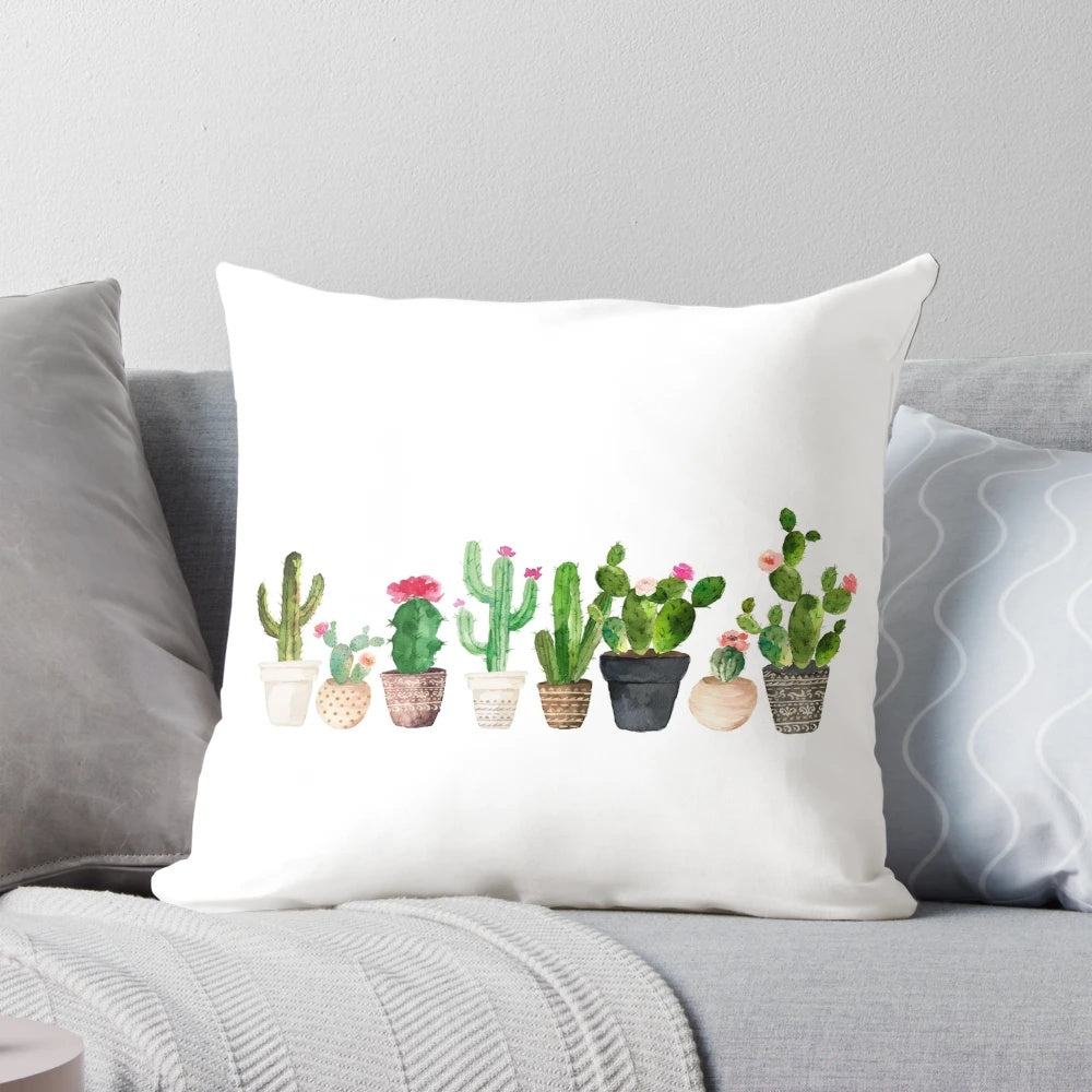 A vibrant, watercolor-style cactus and succulent print on a soft, plush pillow for natural, desert-inspired home decor.