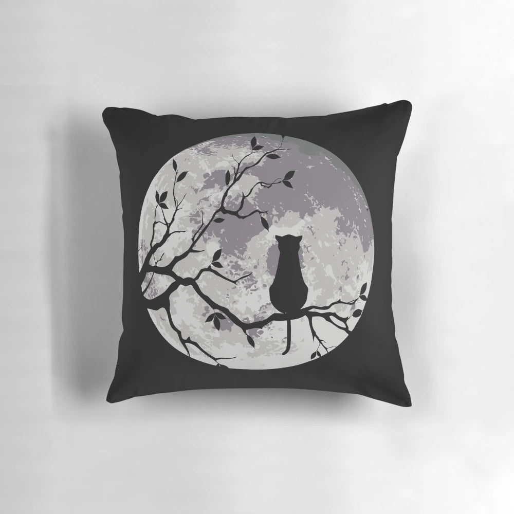 A cozy and enchanting cat and moon decorative pillow for a peaceful night's sleep.