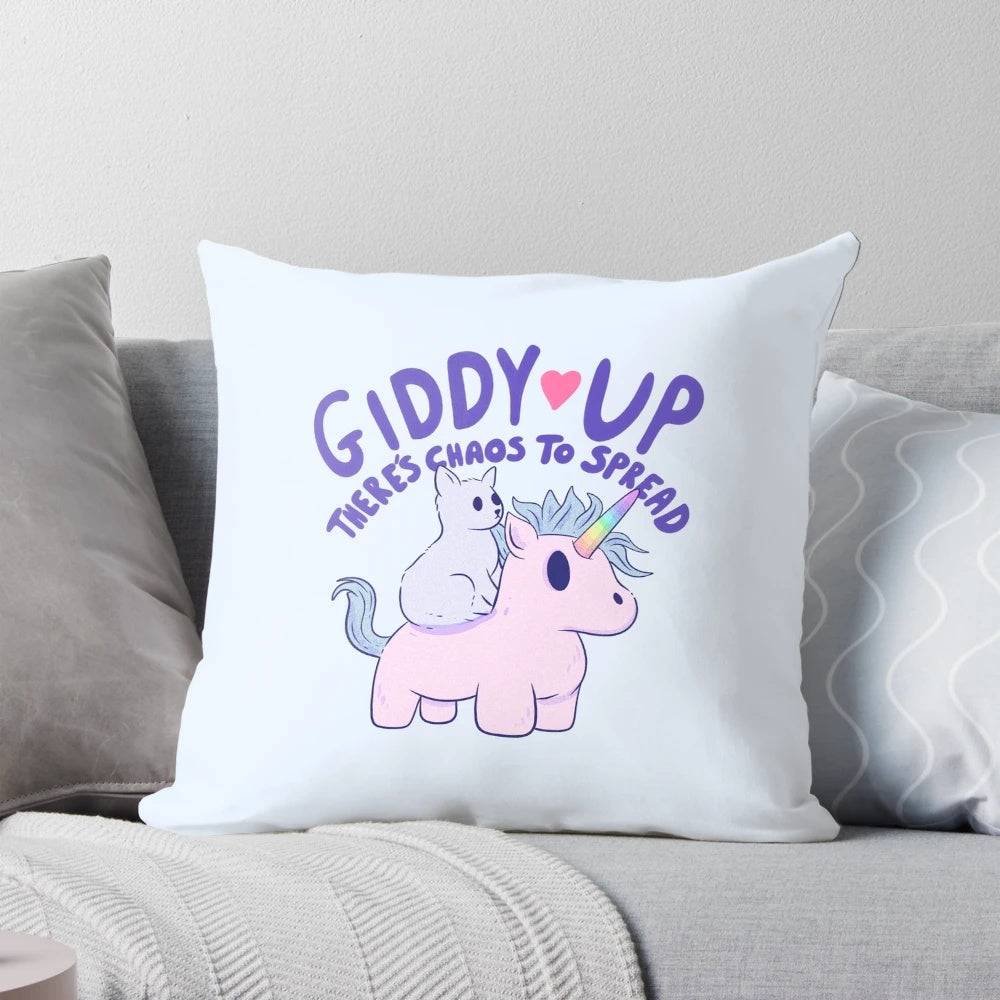 Cute cat riding a unicorn on a colorful, whimsical pillow.
