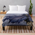 Plush blanket with a dark, starry night design featuring fairies and fantasy elements