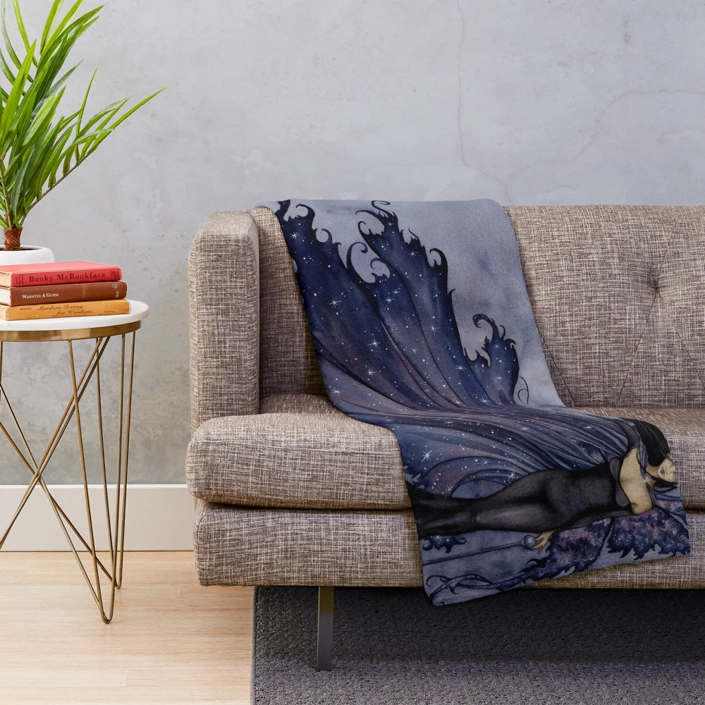 Plush blanket with a dark, starry night design featuring fairies and fantasy elements