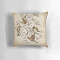 Soft, plush pillow featuring a whimsical design of birds perched in a cherry blossom tree