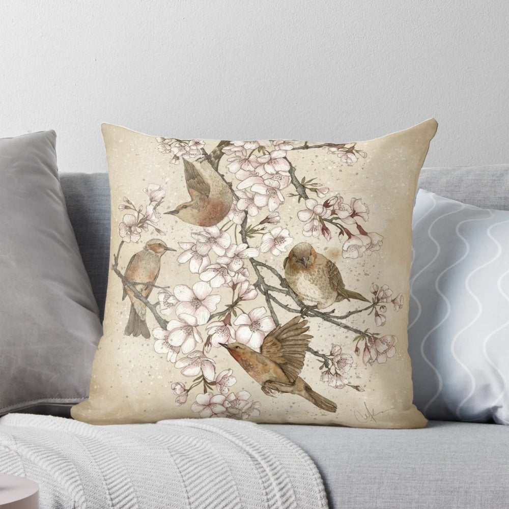 Soft, plush pillow featuring a whimsical design of birds perched in a cherry blossom tree