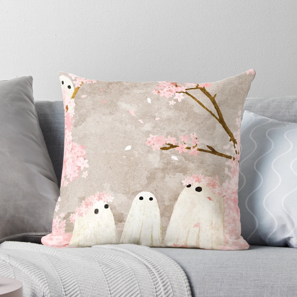 Decorative cherry blossom throw pillow with a whimsical, spooky design