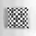 A cozy and whimsical chess pillow featuring a detailed chess board and pieces design.
