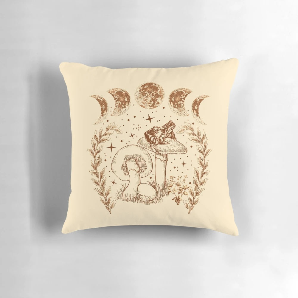 Cottagecore-inspired pillow featuring a whimsical frog sitting on a mushroom under a starry night sky