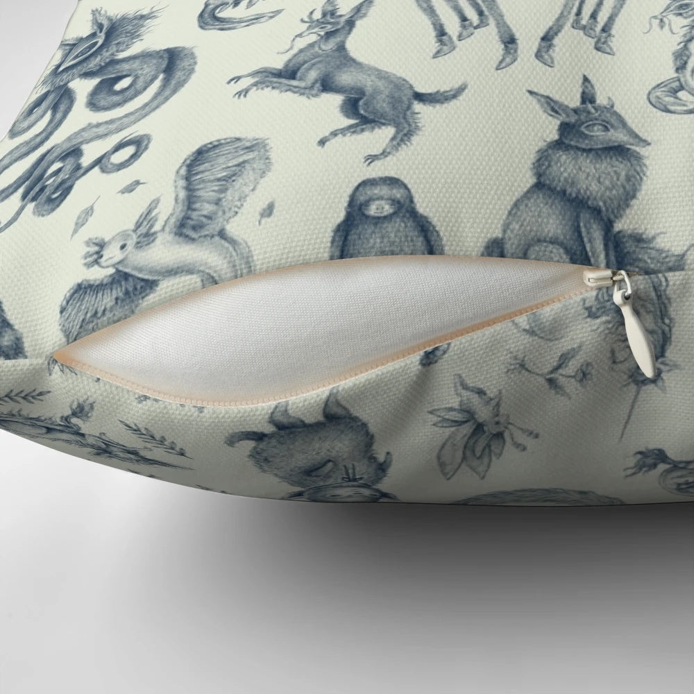 Throw pillow featuring a whimsical pattern of fantasy creatures like mythical beasts, wizards, and witches in a pastel, light-filled design.