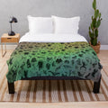 Colorful plush blanket featuring a variety of mythical cryptids and creatures