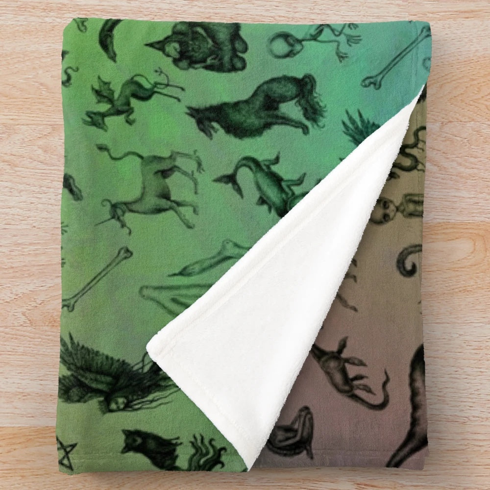 Colorful plush blanket featuring a variety of mythical cryptids and creatures