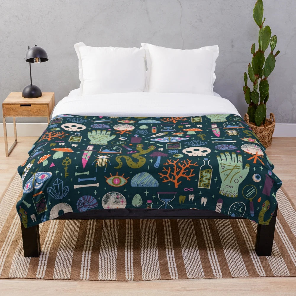 Curiosities plush blanket featuring a cabinet of wonders design