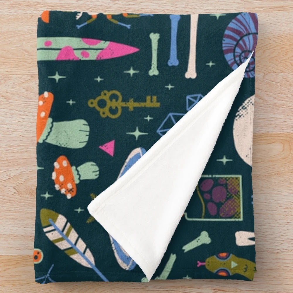 Curiosities plush blanket featuring a cabinet of wonders design