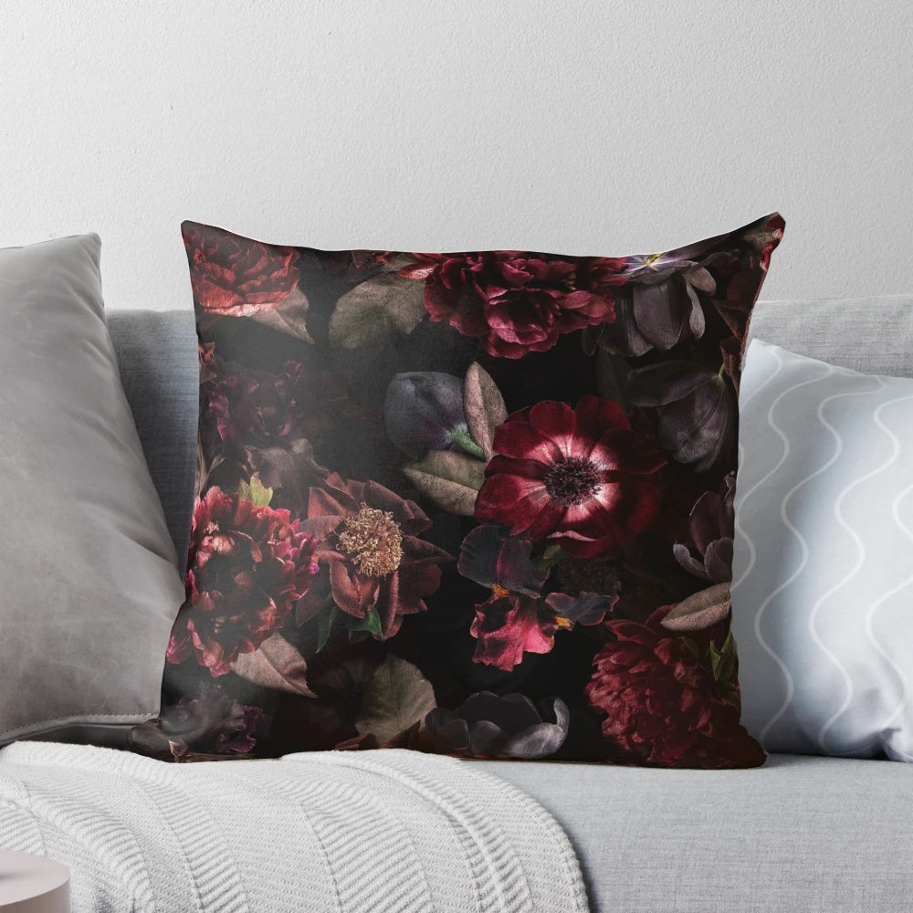 Dark midnight roses and botanical elements on a cozy, pillow for a mystical garden ambiance.