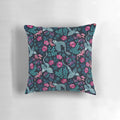 Vibrant dark floral pillow featuring watercolor illustrations of dragons, roses, and other nature-inspired motifs in rich jewel tones.