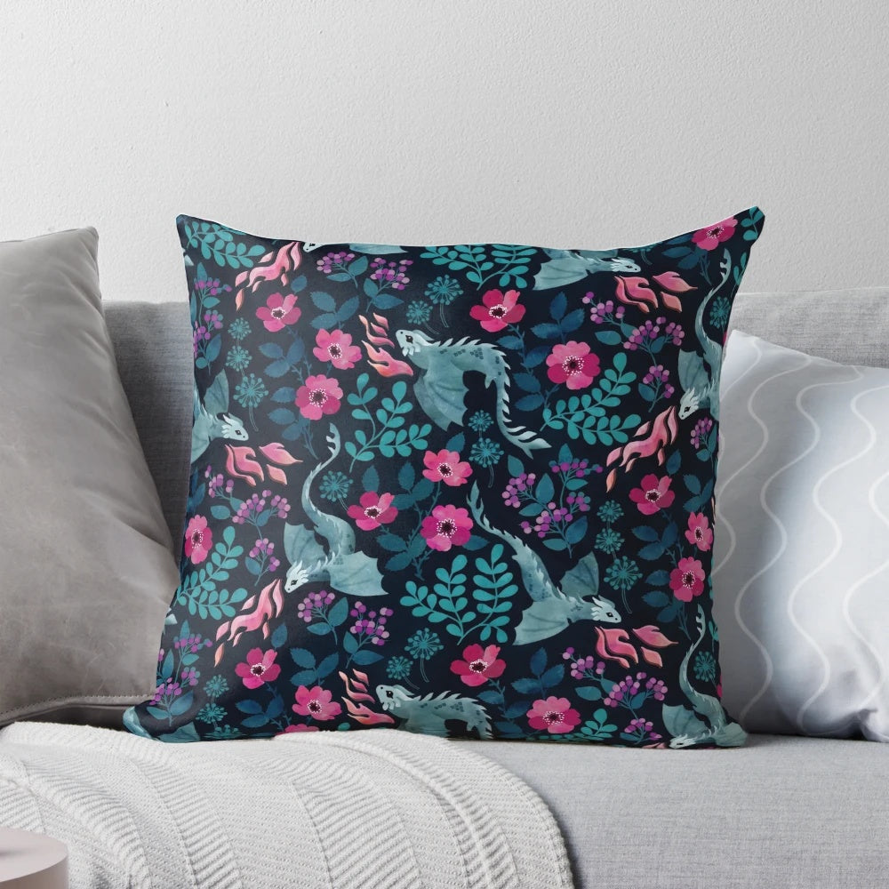 Vibrant dark floral pillow featuring watercolor illustrations of dragons, roses, and other nature-inspired motifs in rich jewel tones.