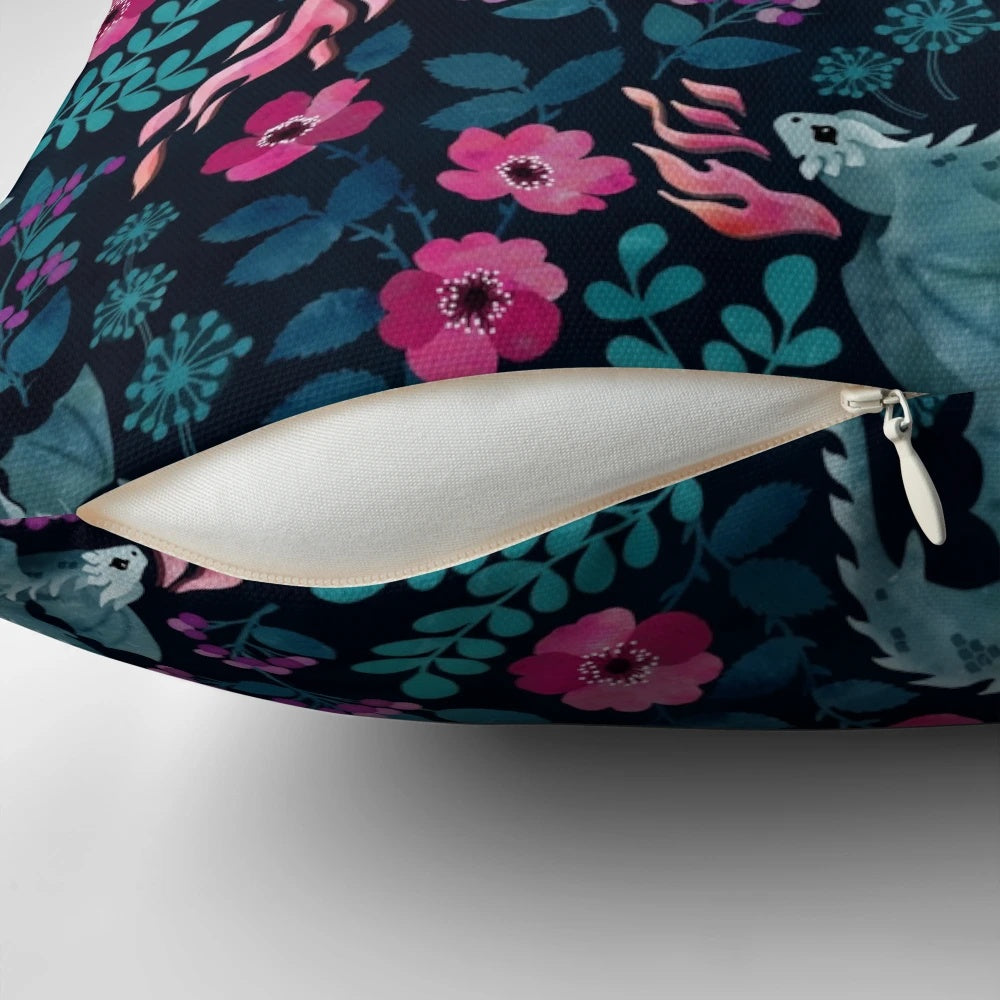 Vibrant dark floral pillow featuring watercolor illustrations of dragons, roses, and other nature-inspired motifs in rich jewel tones.