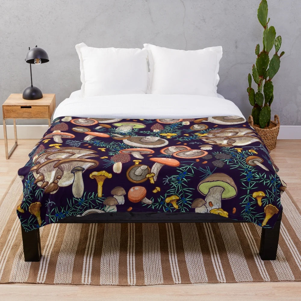 Dark forest plush blanket with mushroom and moss design