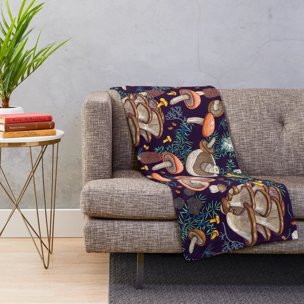 Dark forest plush blanket with mushroom and moss design