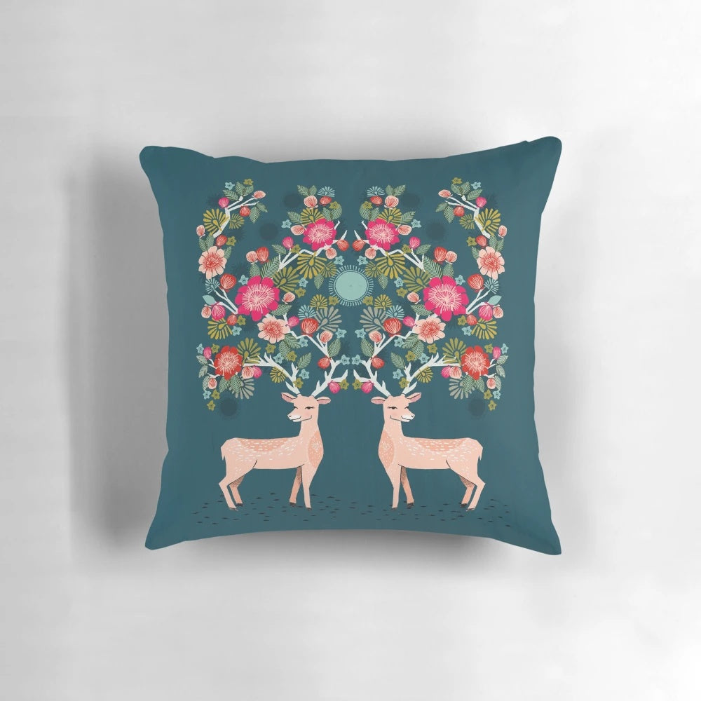 A beautiful deer and floral print pillow designed by Andrea Lauren