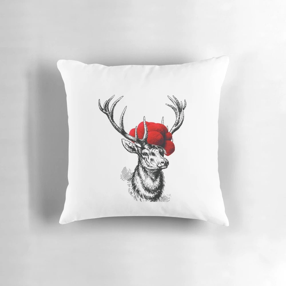 Decorative throw pillow featuring a deer wearing a traditional pollen hat, or Bollenhut, against a black forest background.