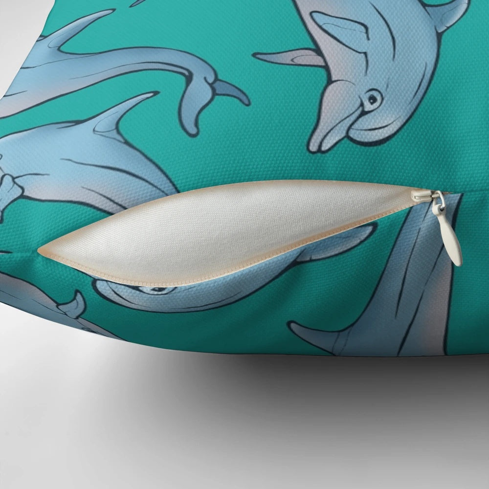 Three decorative pillows featuring a detailed dolphin design in shades of blue and grey, created with ink and pen artwork.