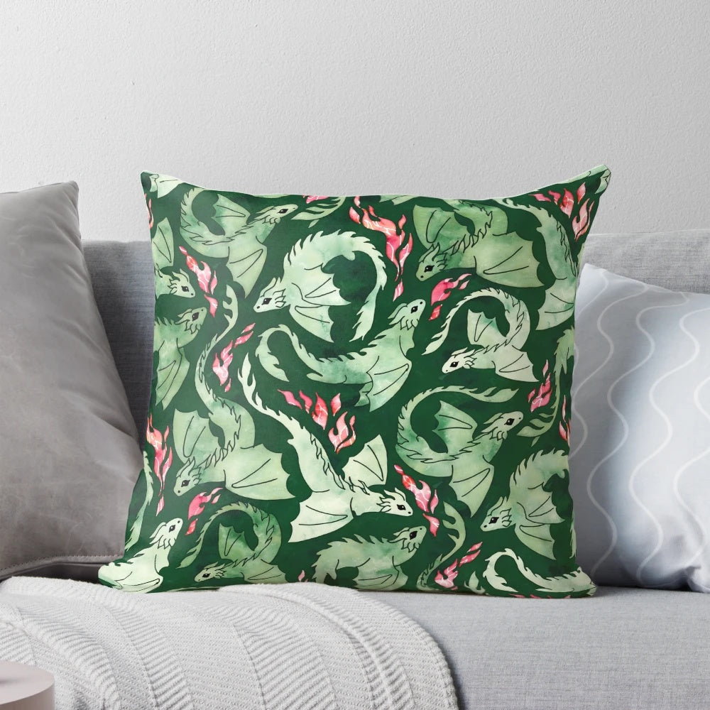 A beautifully designed dragon fire dark green pillow featuring a watercolor-inspired design of a fire-breathing dragon in shades of green, blue, and scarlet.
