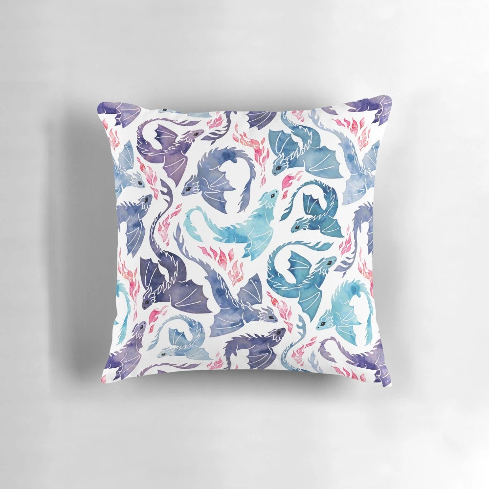 A stunning Pillow featuring a magical dragon with fire breathing and turquoise and purple watercolor design