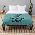 Plush dragon-themed blanket with intricate design