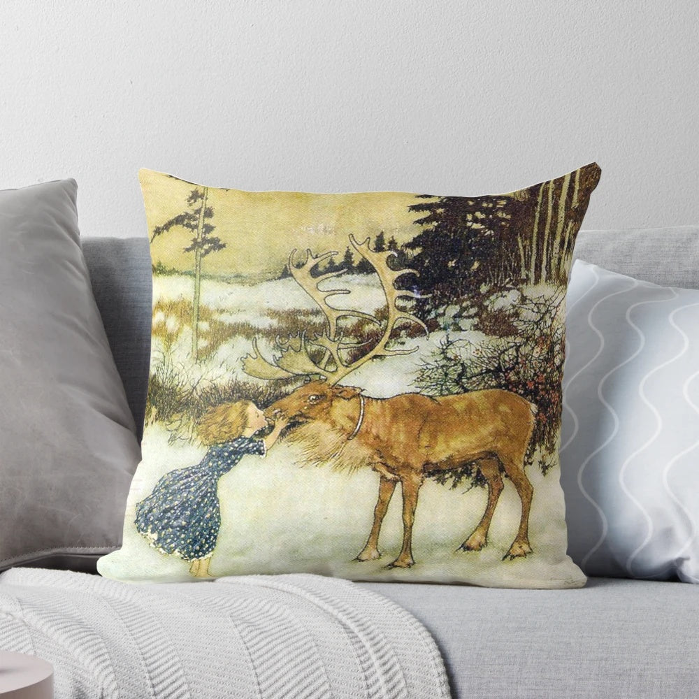 Decorative pillow featuring the iconic illustration "Gerda and the Reindeer" by Edmund Dulac, depicting a girl kissing a reindeer in a snowy winter landscape.
