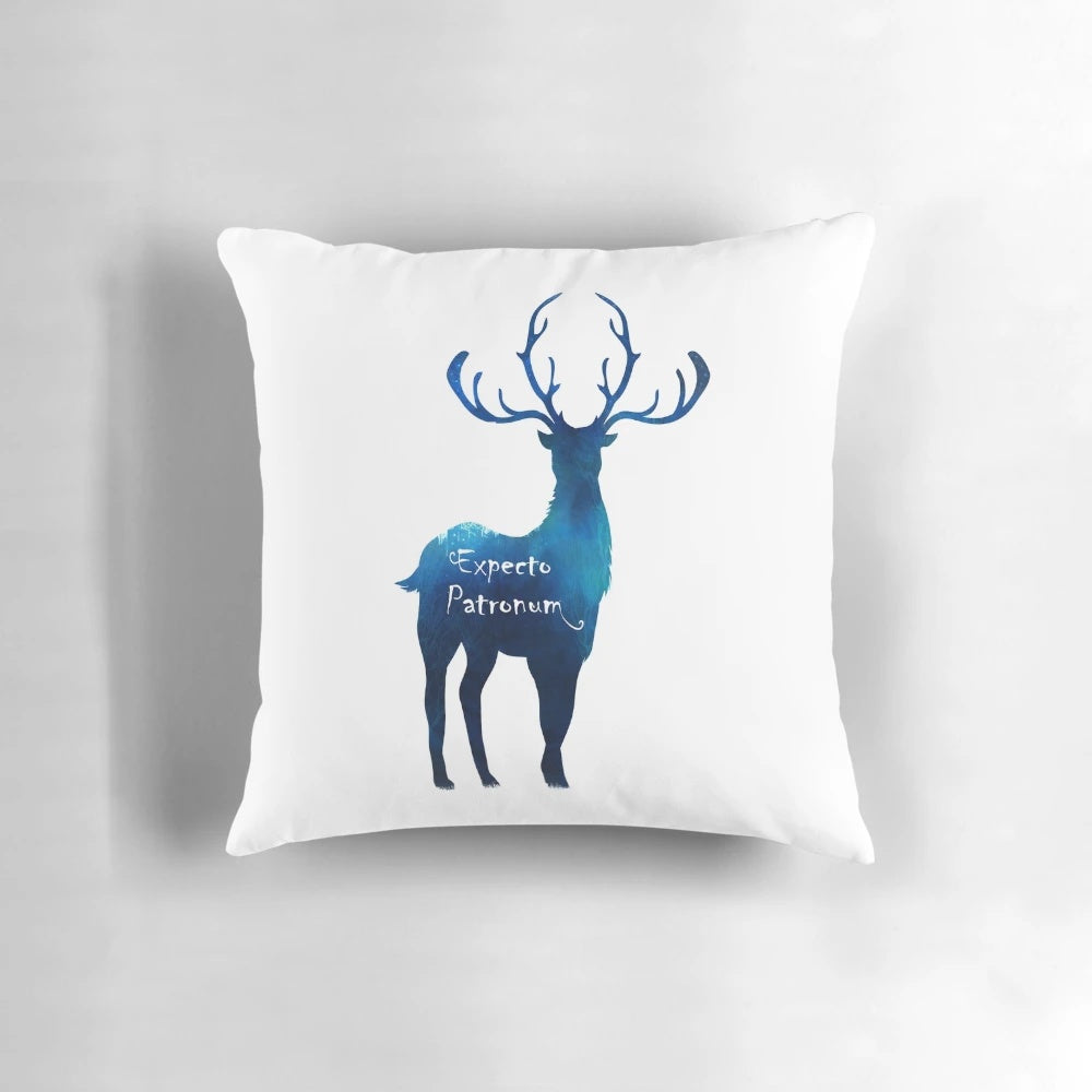 Cozy blue and wood-toned pillow featuring a magical deer design, inspired by the Expecto Patronum spell from the Harry Potter movies.