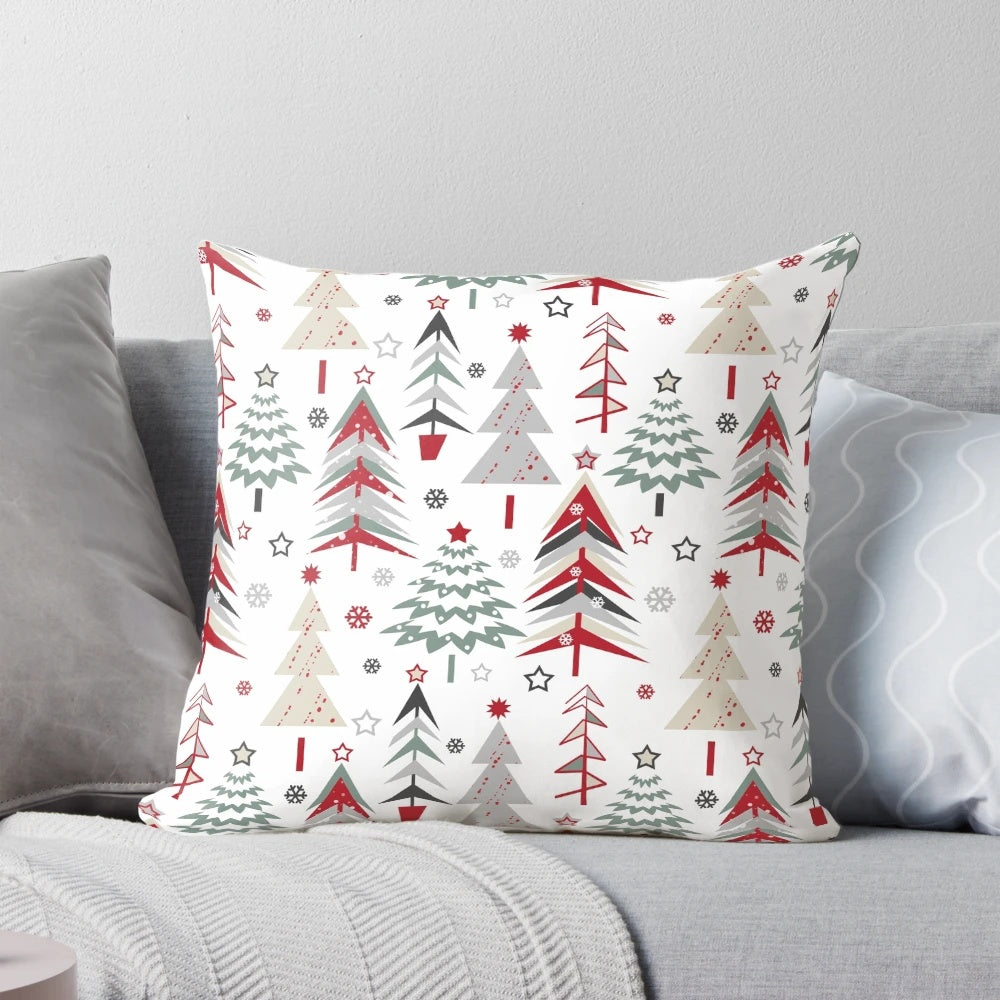 A cozy pillow featuring a whimsical forest scene with spruce trees, a Christmas tree, and a festive red and white palette, perfect for the holiday season.