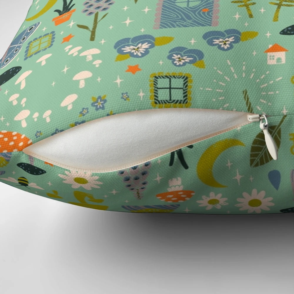 Whimsical fairy garden-inspired throw pillow with mint, pastel, and floral motifs
