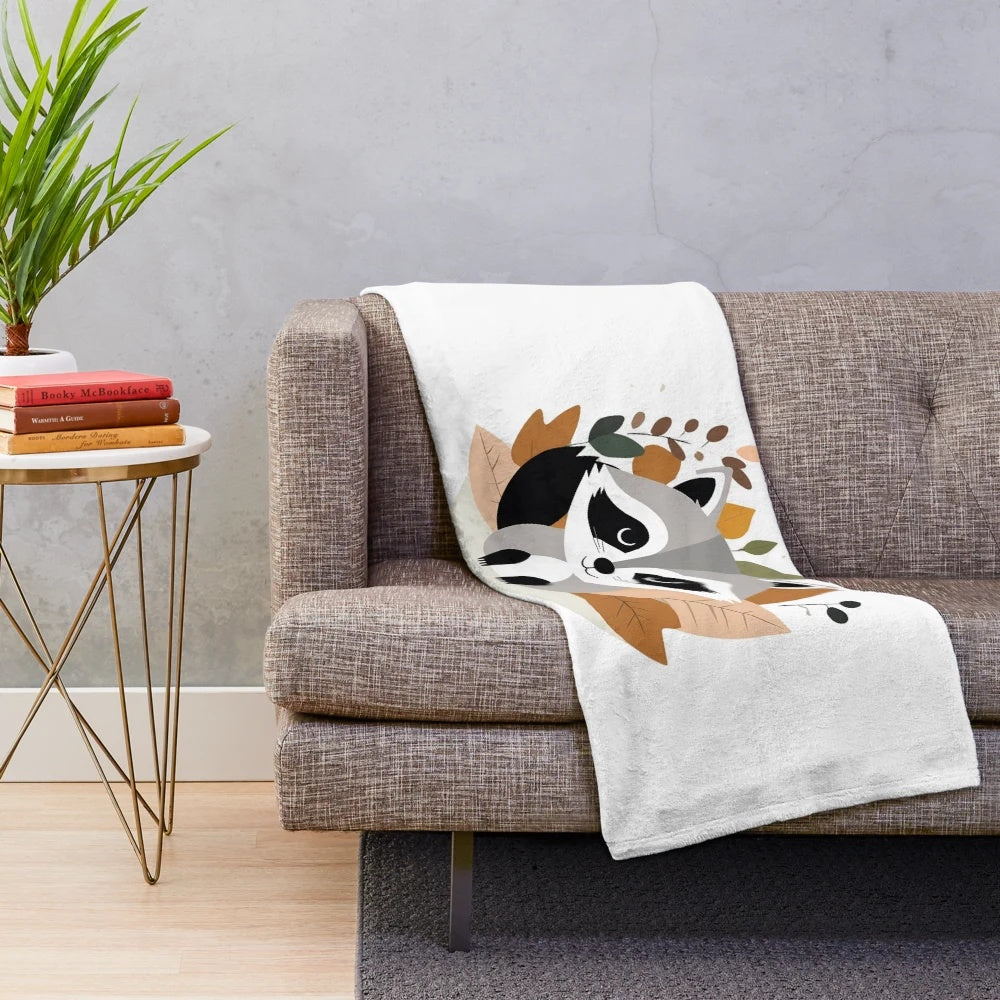 Autumn-themed plush blanket featuring a cute raccoon and fall leaves design