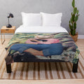 Plush blanket featuring a fantasy art depiction of a cat woman with fishes