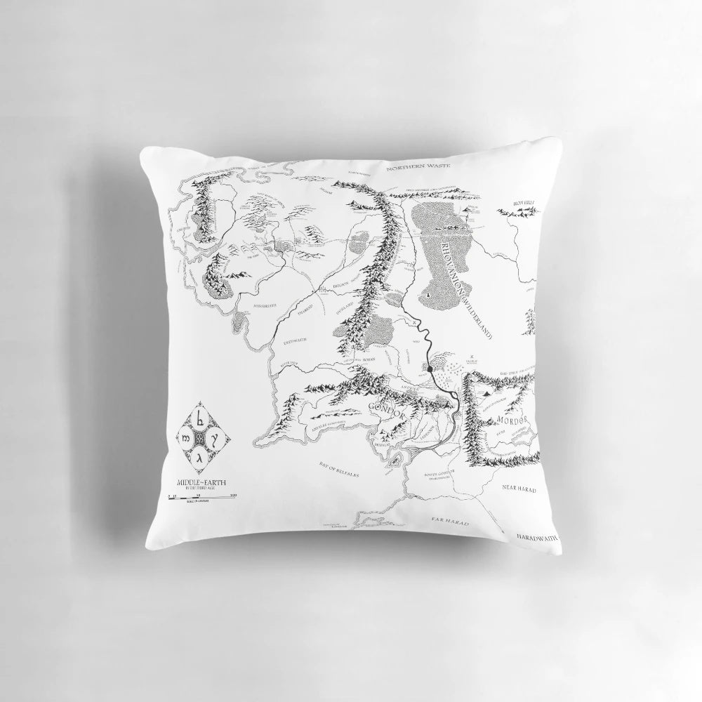 Decorative fantasy map pillow featuring a black and white illustration of Middle Earth from the Lord of the Rings series