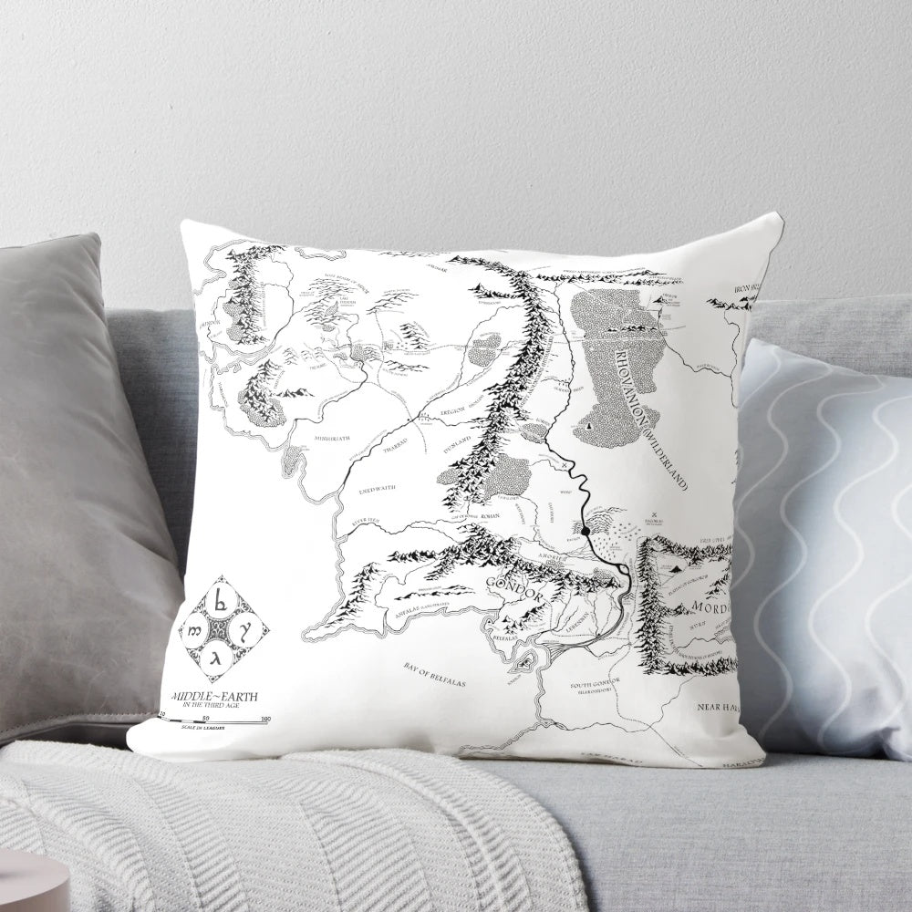 Decorative fantasy map pillow featuring a black and white illustration of Middle Earth from the Lord of the Rings series