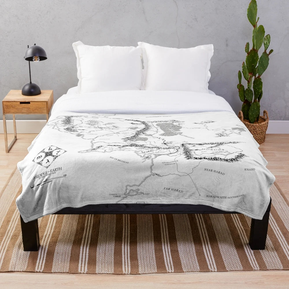Cozy plush blanket featuring a black and white fantasy map design inspired by the works of J.R.R. Tolkien.