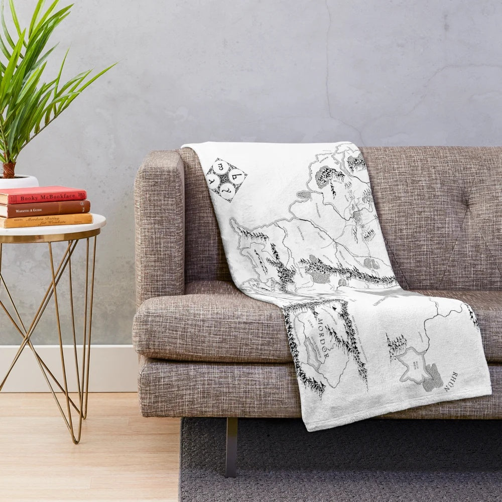 Cozy plush blanket featuring a black and white fantasy map design inspired by the works of J.R.R. Tolkien.