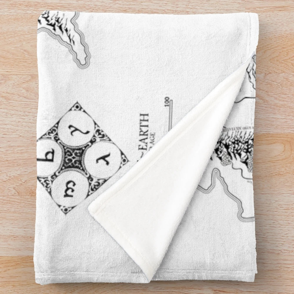 Cozy plush blanket featuring a black and white fantasy map design inspired by the works of J.R.R. Tolkien.