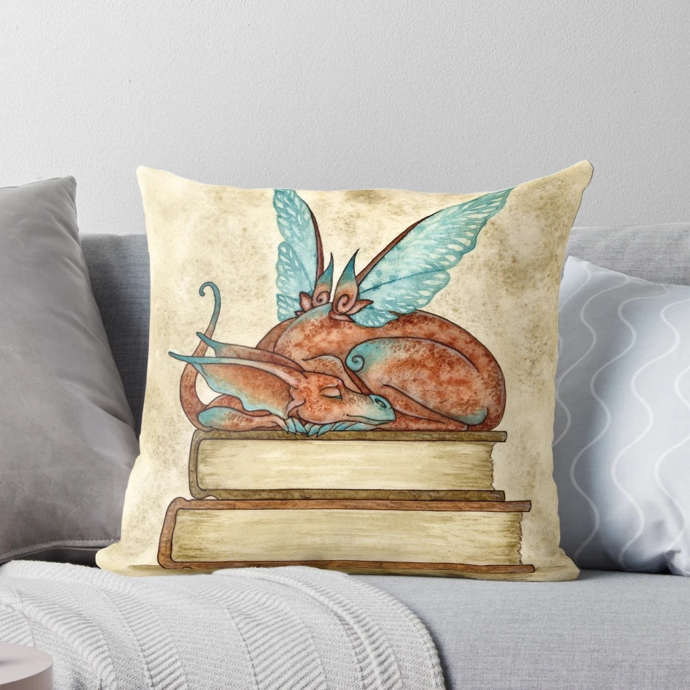 Whimsical fantasy-inspired pillow featuring dragons, fairies, and a magical book motif