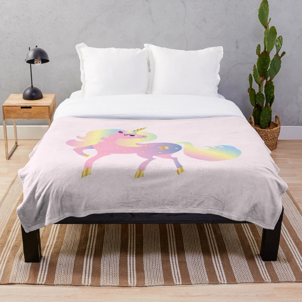 Soft and fluffy plush blanket featuring a colorful, whimsical unicorn design