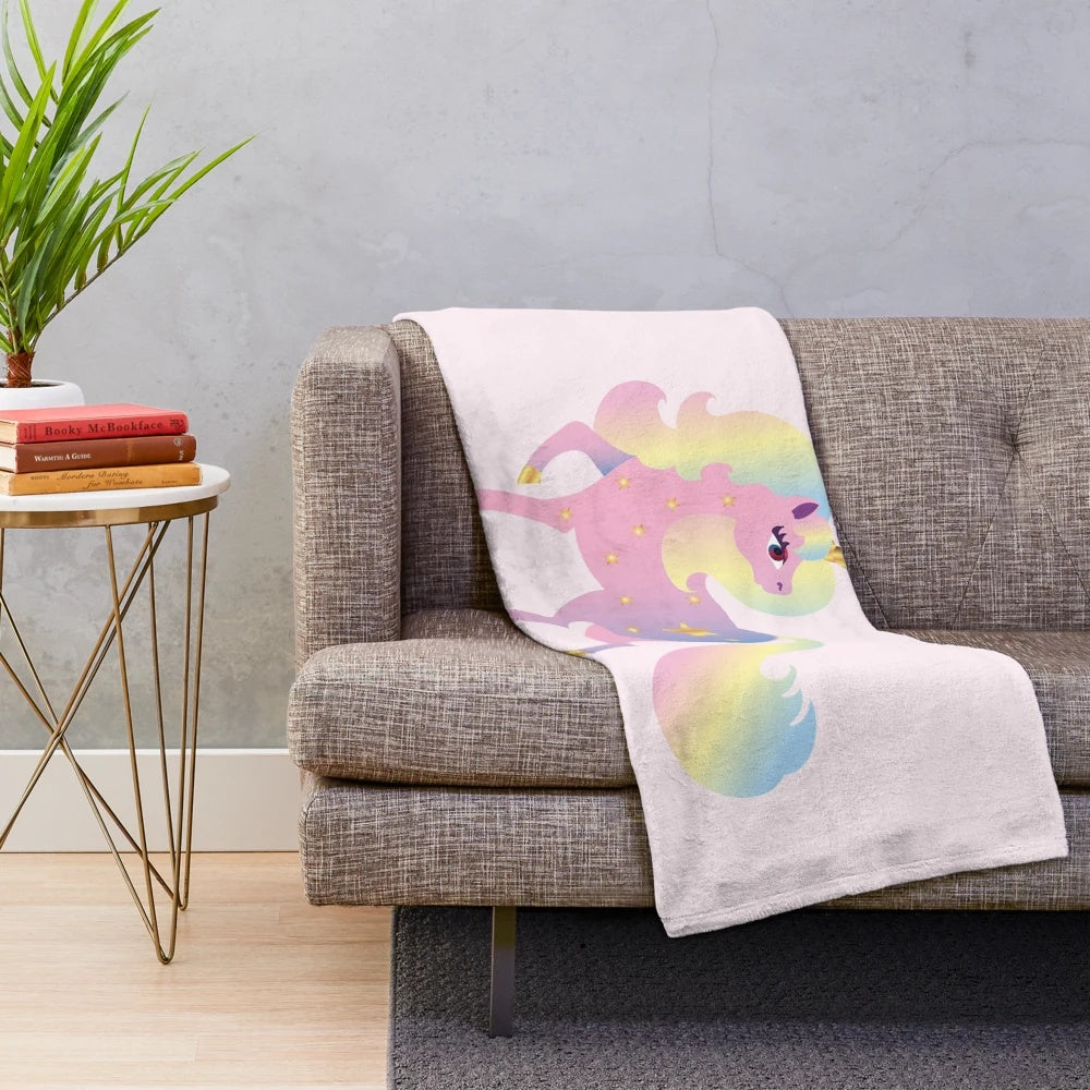 Soft and fluffy plush blanket featuring a colorful, whimsical unicorn design