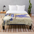 Soft and cozy plush blanket with fantasy bookworm design